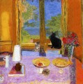 cats seated on table